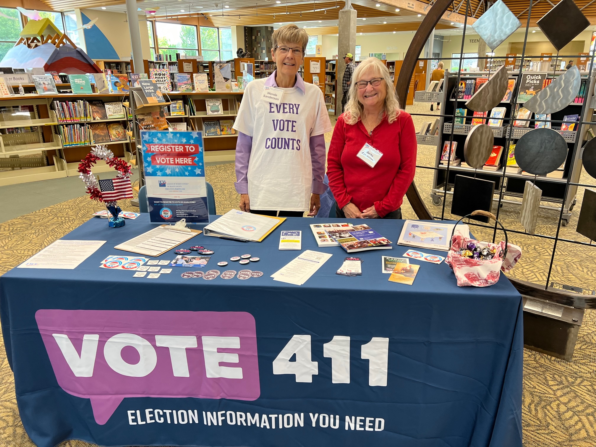 Wende and Becky registering voters at Burlington Library